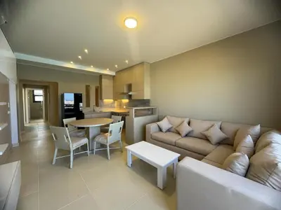 a living room with a couch and a table at 3 bedrooms penthouse with sea view in Hurghada