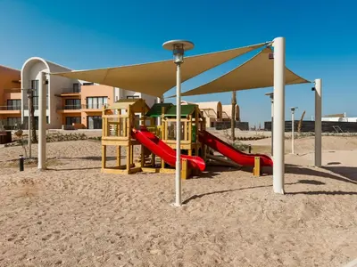 a playground on the beach with a canopy at Gouna Ground-Floor Stylish 2Bdr in Hurghada