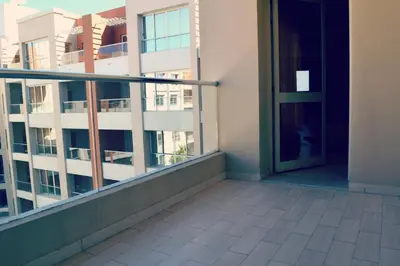 a balcony with an open door in a building at Rivoli Suites in Hurghada