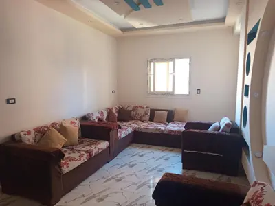 a living room with couches and a couch at hurghada , Elhegaz road in Hurghada