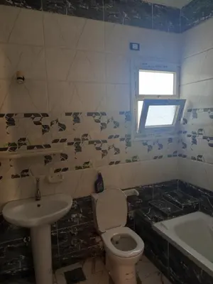a bathroom with a toilet and a sink at hurghada , Elhegaz road in Hurghada