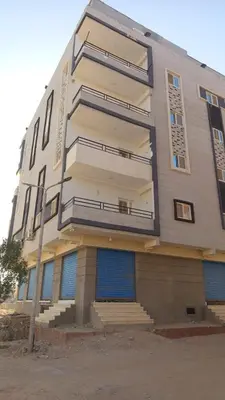 a building with blue doors and stairs on it at hurghada , Elhegaz road in Hurghada