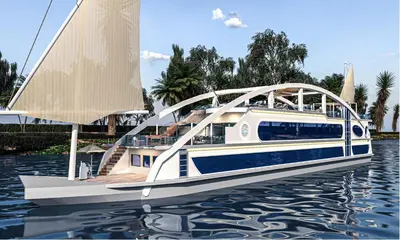a boat with a bridge on the water at Sola Dahabiya Nile Cruise Every Monday from Luxor to Aswan 4 nights and Every Friday from Aswan to Luxor 3 nights in Luxor