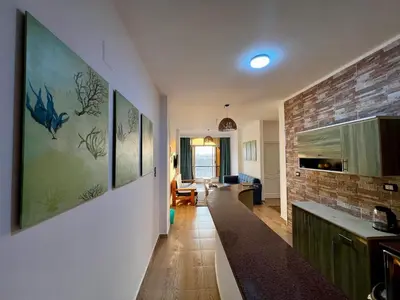 a hallway with a kitchen and a living room at Beautiful desert, mountains, Hurghada skyline view in Hurghada