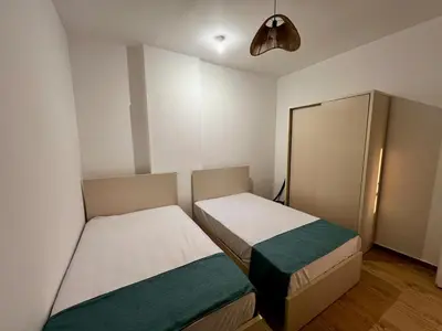 a small room with two beds and a fan at Beautiful desert, mountains, Hurghada skyline view in Hurghada