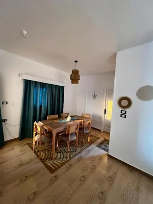 a dining room with a table and chairs at Beautiful desert, mountains, Hurghada skyline view in Hurghada