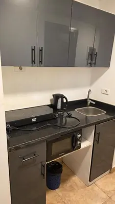 a kitchen with a sink and a counter top at florenza-50 in Hurghada