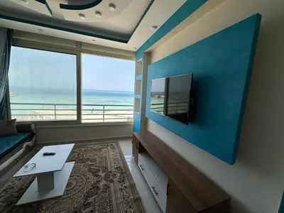 a living room with a view of the ocean at كورنيش القيادات in Hurghada