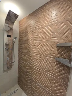 a wooden wall in a bathroom with a shower at Dive Hostel Hurghada Tiba Golden in Hurghada