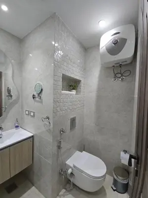 a bathroom with a shower and a toilet and a sink at Dive Hostel Hurghada Tiba Golden in Hurghada