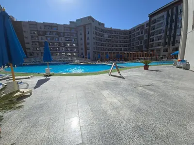 a large swimming pool in front of a building at Dive Hostel Hurghada Tiba Golden in Hurghada