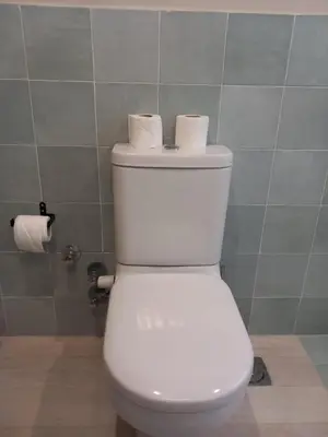 a bathroom with a toilet with two rolls of toilet paper at Modern Marina View 2 beds apt -New Marina-El Gouna in Hurghada