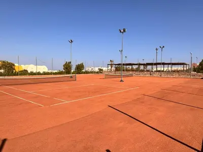 a tennis court with two tennis nets on it at Boho 2-BDR Haven in Makadi Heights - By Kemetland in Hurghada