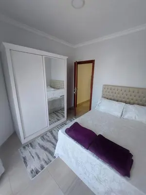 a bedroom with a large bed and a mirror at Appartement for rent in Hurghada in Hurghada