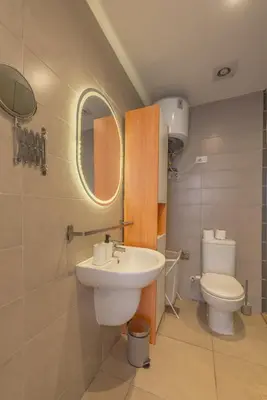 a bathroom with a sink and a toilet at 2-Bedroom Penthouse in G-Cribs Gouna in Hurghada