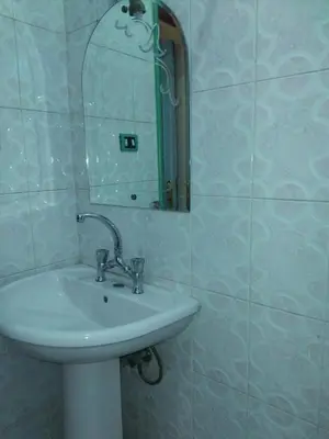 a bathroom with a sink and a mirror at Ramsess Hotel in Luxor