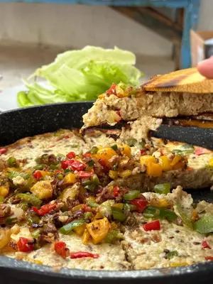 a pan of food with a slice of bread and vegetables at Per Ankh - Heissa island - Aswan in Aswan