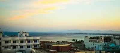 a view of a city with the ocean and buildings at Kite Lodging in Hurghada