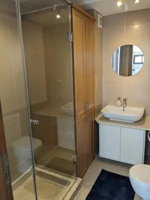 a bathroom with a glass shower and a sink at 2BR Pool Front Soma bay Villa Near Mesca Beach in Hurghada