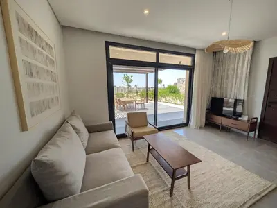 a living room with a couch and a table at Spacious 3BR Apartment Glorious Panoramic Seaviews in Hurghada