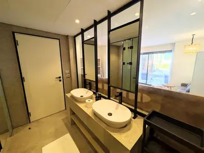 a bathroom with two sinks and a large mirror at Beachy Pool side Mesca Cabana Somabay Steps to Sea in Hurghada