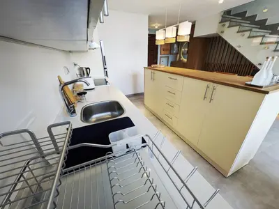 a kitchen with a sink and a counter top at Beautiful 2BR Mesca Beach Front Loft in Soma bay in Hurghada