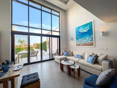 a living room with a couch and a table at Beautiful 2BR Mesca Beach Front Loft in Soma bay in Hurghada