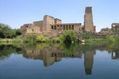 a building with its reflection in a body of water at Nubiana Boat