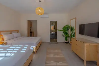 a bedroom with a bed and a flat screen tv at Dreamy Studio in Bali Compound, El Gouna in Hurghada