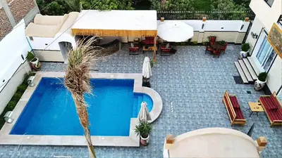 an overhead view of a patio with a swimming pool at Hamed's House Luxor in Luxor