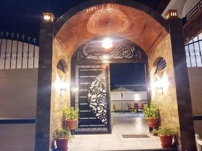 an entrance to a building with a black door at Hamed's House Luxor in Luxor