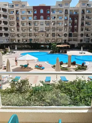 a view of the pool at a resort at فلورانزا خمسين f012 in Hurghada