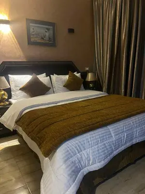 a bedroom with a large bed in a room at Grand Cleopatra Hotel-Luxor in Luxor