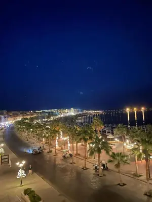 a city at night with palm trees and lights at Tawaya Sahl Hasheesh 2 bedrooms in Hurghada