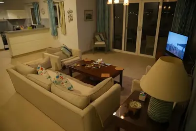 a living room with a couch and a table at Stunning 4BD Apartment Lagoon View-Gouna in Hurghada