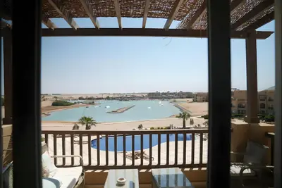 a view from the balcony of a resort with a pool at Stunning 4BD Apartment Lagoon View-Gouna in Hurghada