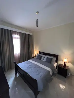 a bedroom with a large bed and a window at Gravity Apartment 410 beautiful apartment with view in structure Gravity Sahl Hasheesh -No Egyptian Passports in Hurghada