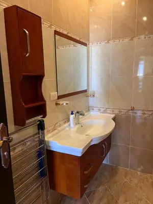 a bathroom with a sink and a mirror at Gravity Apartment 410 beautiful apartment with view in structure Gravity Sahl Hasheesh -No Egyptian Passports in Hurghada