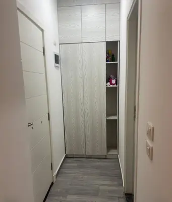 a hallway with a white closet with a door at 412atthepavilionimperialHurghada in Hurghada