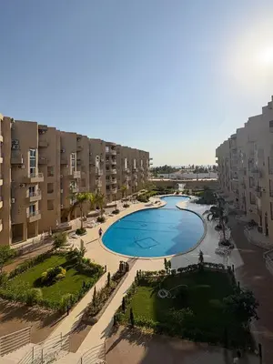 an overhead view of a swimming pool in an apartment complex at Amazing View! Beach Access & Pool Hurghada in Hurghada