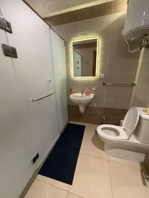 a bathroom with a toilet and a sink at Amazing View! Beach Access & Pool Hurghada in Hurghada