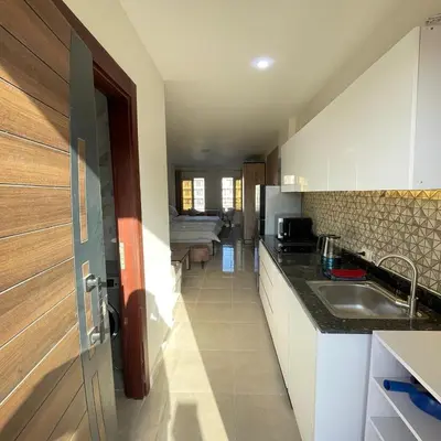 a kitchen with a sink and a counter top at Tiba Golden Resort Hurghada in Hurghada