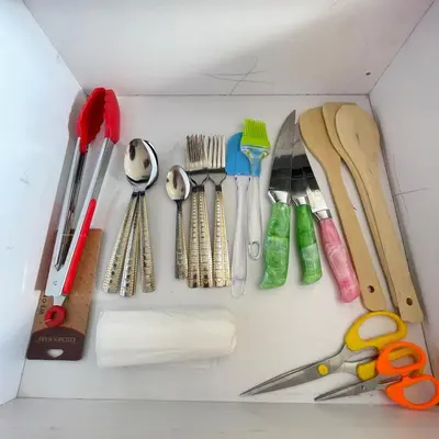 a drawer filled with lots of different types of utensils at Tiba Golden Resort Hurghada in Hurghada