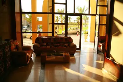 a living room with a couch and a coffee table at 310 el Andalous Apartment in Hurghada