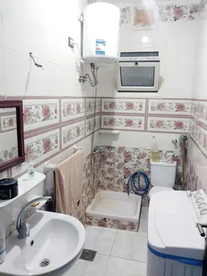 a bathroom with a sink and a toilet at Economy Onebedroom Apartment Hurghada in Hurghada