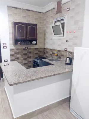 a kitchen with a counter top and a sink at Economy Onebedroom Apartment Hurghada in Hurghada