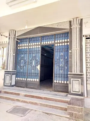 an entrance to a building with a blue door at Economy Onebedroom Apartment Hurghada in Hurghada