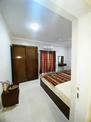 a bedroom with a large bed and a window at nubian yellow desert in Aswan