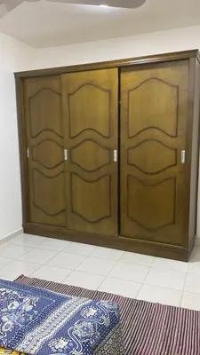 two wooden doors in a room with a rug at الغردقة - القيادات - بالقرب من سيتي سنتر مول و شاطئ الجيش in Hurghada
