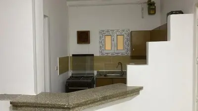 a kitchen with a stove and a sink at الغردقة - القيادات - بالقرب من سيتي سنتر مول و شاطئ الجيش in Hurghada